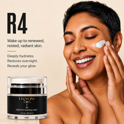 A woman with short dark hair applies a white cream to her cheek against a warm beige background. On the left is a black jar labeled IKNOW R4 night time hydrating cream&
