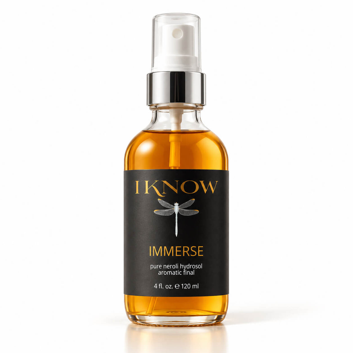 A bottle of IKnow Immerse pure neroli hydrosol aromatic facial mist, featuring amber liquid in a clear glass bottle with a black label and silver spray nozzle, set against a clean white background.