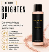 Black skincare product bottle with text on a beige background
